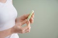 Woman holding tampon on color background Royalty Free Stock Photo