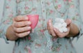 Woman holding tampons and menstrual cup in hands Royalty Free Stock Photo