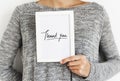 Woman holding a Thank You card Royalty Free Stock Photo