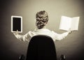 Woman holding traditional book and e-book reader