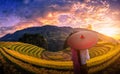 Woman holding traditional red umbrella on Rice fields terraced w Royalty Free Stock Photo