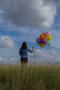 Beautiful woman Holding a transparent ball in the grass field