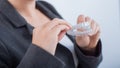 A woman is holding a transparent plastic mouth guard. Orthodontist's bite correction device Royalty Free Stock Photo