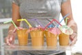 Woman holding a tray with cups Royalty Free Stock Photo