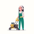 Woman holding trolley cart with supplies female cleaner janitor in uniform cleaning service concept flat full length