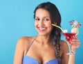 Woman holding tropical cocktail with decorative umbrella Royalty Free Stock Photo