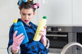 Woman holding two bottles of cleaners Royalty Free Stock Photo