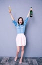 Woman holding two glass and bottle of champagne Royalty Free Stock Photo