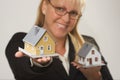 Woman Holding Two Houses Royalty Free Stock Photo