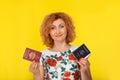 Woman holding two red European Union Bulgarian and blue American passports