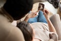 Woman holding ultrasound image of her baby showing her husband details on it. Royalty Free Stock Photo