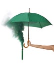 Woman holding umbrella and green smoke bomb on white background  closeup Royalty Free Stock Photo