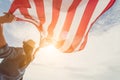 Woman holding United States of America flag and running, Royalty Free Stock Photo