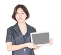 Woman holding up blank tablet computer