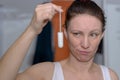 Woman holding up a tampon for heavy blood flow