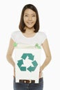 Woman holding up a recycling bin filled with plastic bottles Royalty Free Stock Photo