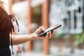 Woman holding and using smartphone for sms messages, young woman typing touchscreen mobile phone. lifestyle, technology, Social Royalty Free Stock Photo