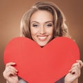 Woman holding Valentines Day heart sign with cop Royalty Free Stock Photo