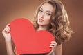 Woman holding Valentines Day heart sign with cop Royalty Free Stock Photo