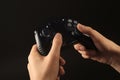 Woman holding video game controller on black, closeup Royalty Free Stock Photo