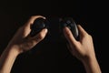 Woman holding video game controller on black, closeup Royalty Free Stock Photo