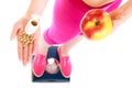 Woman holding vitamins and apple. Health care. Royalty Free Stock Photo