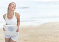 Woman holding weighing scale on the beach Royalty Free Stock Photo