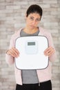 woman holding weighting scale Royalty Free Stock Photo