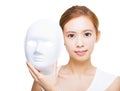 Woman holding white mask for skincare concept Royalty Free Stock Photo