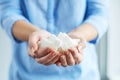 Woman holding white sugar cubes Royalty Free Stock Photo