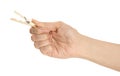Woman holding wooden clothespin on white background, closeup Royalty Free Stock Photo