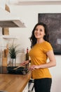 Woman holding wooden spatula near frying Royalty Free Stock Photo