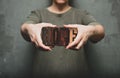 Woman holding the word `hope` made of wooden typographic letters