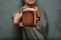 Woman holding the word `me` made of wooden typographic letters