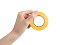 Woman holding yellow insulating tape on white background, closeup