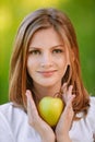 Woman holds apple