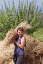 Woman holds armful of wheat Royalty Free Stock Photo
