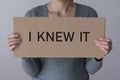 A woman holds a banner with the inscription I KNEW IT Royalty Free Stock Photo