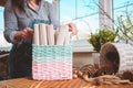 Woman holds basket with sets for basketmaker