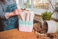 Woman holds basket with sets for basketmaker