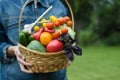 Woman holds a basket with vegetables. Healthy eating