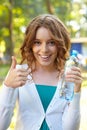 woman holds bottle of mineral water. Royalty Free Stock Photo