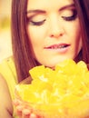 Woman holds bowl full of sliced orange fruits Royalty Free Stock Photo