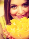 Woman holds bowl full of sliced orange fruits Royalty Free Stock Photo