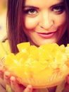 Woman holds bowl full of sliced orange fruits Royalty Free Stock Photo