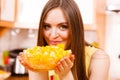 Woman holds bowl full of sliced orange fruits Royalty Free Stock Photo