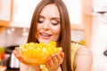 Woman holds bowl full of sliced orange fruits Royalty Free Stock Photo