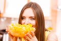 Woman holds bowl full of sliced orange fruits Royalty Free Stock Photo