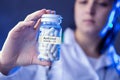 Woman holds box of antiviral medicines