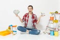 Woman holds bundle of cash money, supermarket grocery push cart for shopping. Instruments for renovation apartment